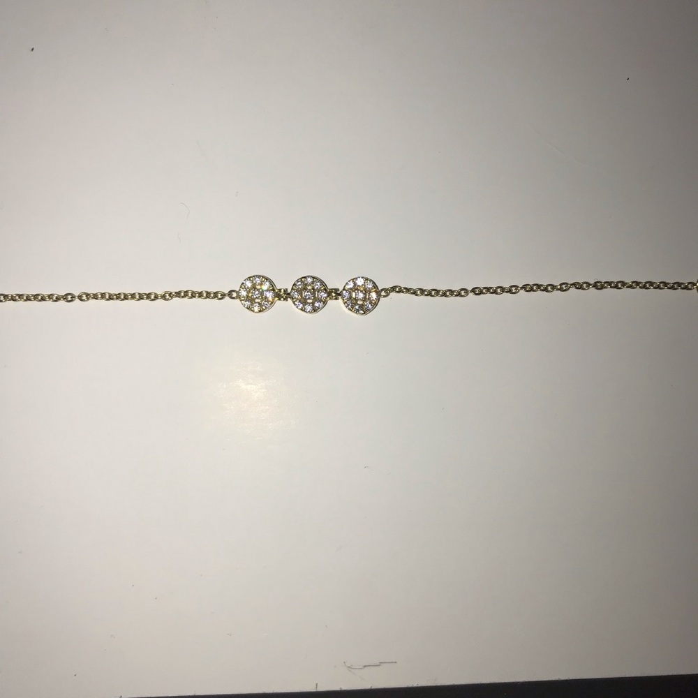 14k gold plated bracket with white diamonds